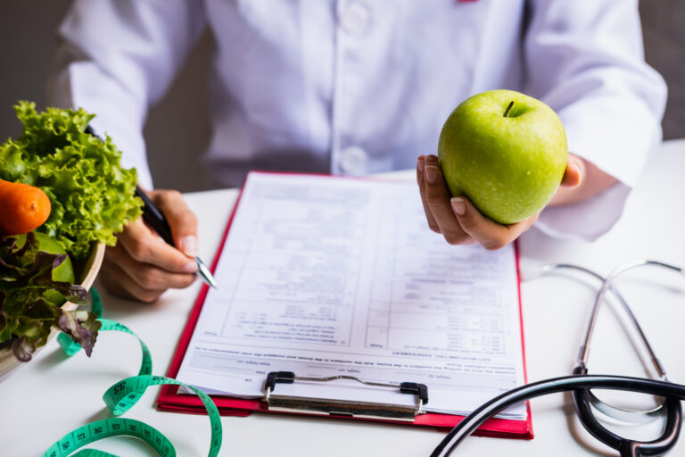 man writes triggers down in a food diary to help manage crohn's disease